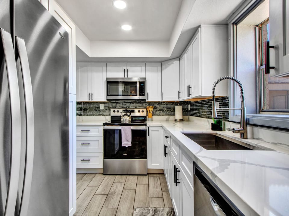 Full size kitchen with plenty of storage. Fully stocked with pots and pans.