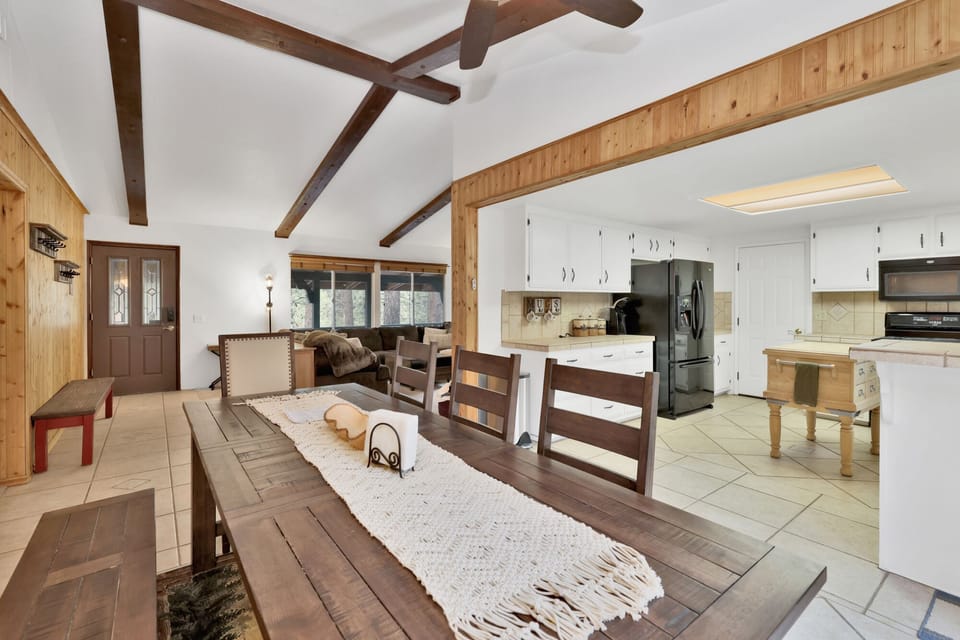 Fully equipped cabin kitchen with ample cabinetry, stove, fridge, microwave, and coffee maker—perfect for cooking meals, morning coffee, and feeling right at home on your stay.