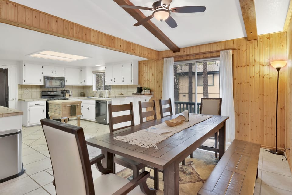 Fully equipped cabin kitchen with ample cabinetry, stove, fridge, microwave, and coffee maker—perfect for cooking meals, morning coffee, and feeling right at home on your stay.