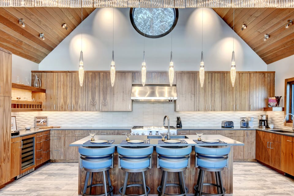 The Stunning Chef's Kitchen With Custom Cabinetry & Lighting Fixtures