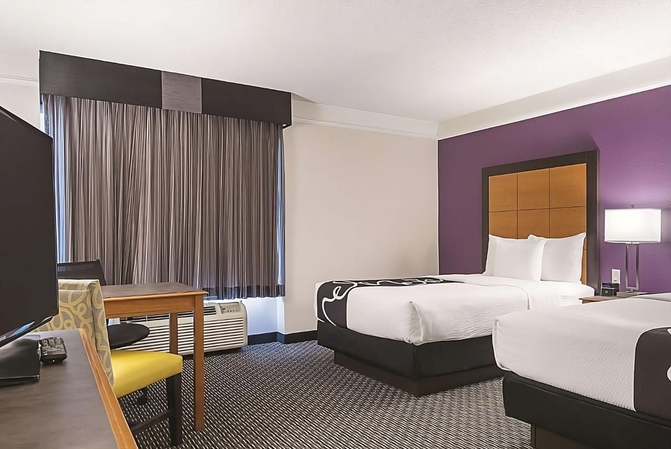 Settle in with roomy comfort, TV entertainment, and blackout drapes.