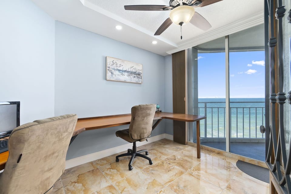 Office, with verti-glide open, showing balcony and the Atlantic Ocean.