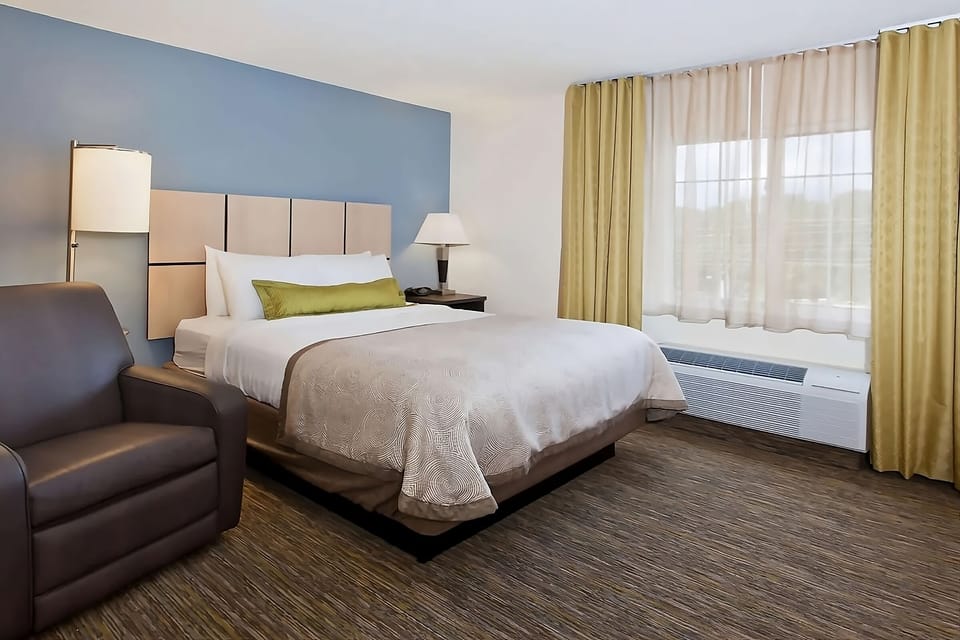 Sink into a plush bed beside bright, airy windows.