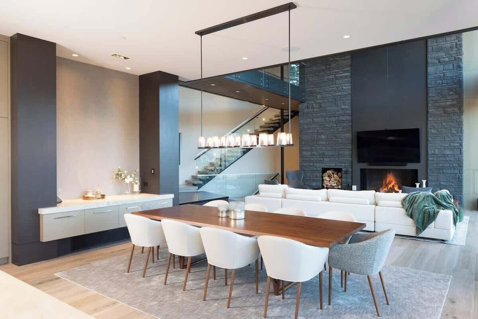 - Open dining and living area with fireplace and mountain backdrop  
- Inviting design with modern furniture and cozy atmosphere  
- Perfect blend of warmth, elegance, and scenic alpine beauty  
