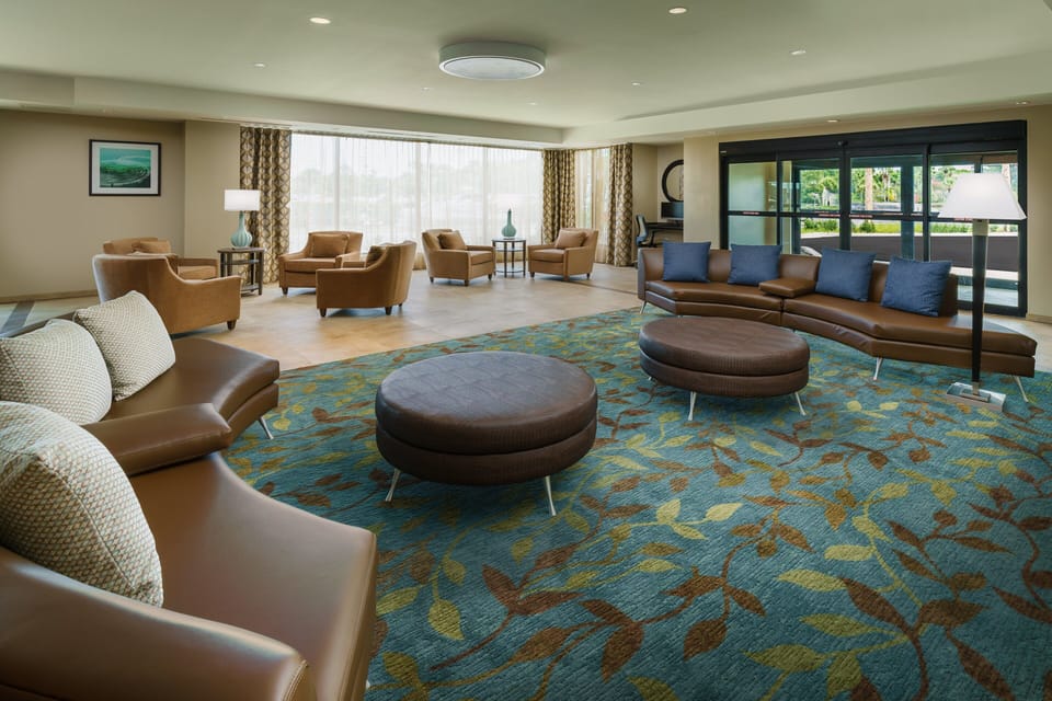 Unwind in the airy lobby with plush seating and natural light.