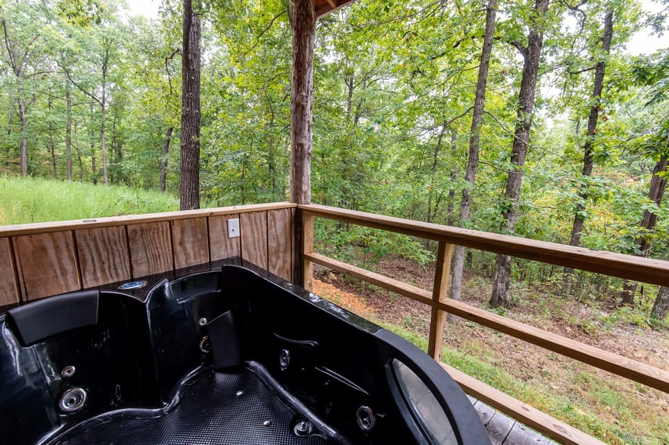 - Private outdoor hot tub overlooking quiet forest scenery   - Relax in warm jets surrounded by trees   - Perfect unwind spot after hiking or exploring