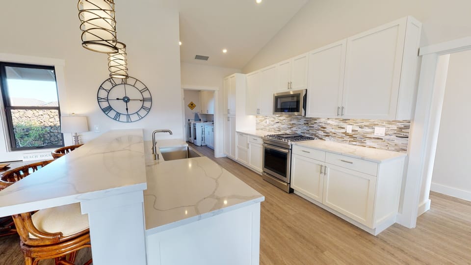 Large kitchen with gas range.