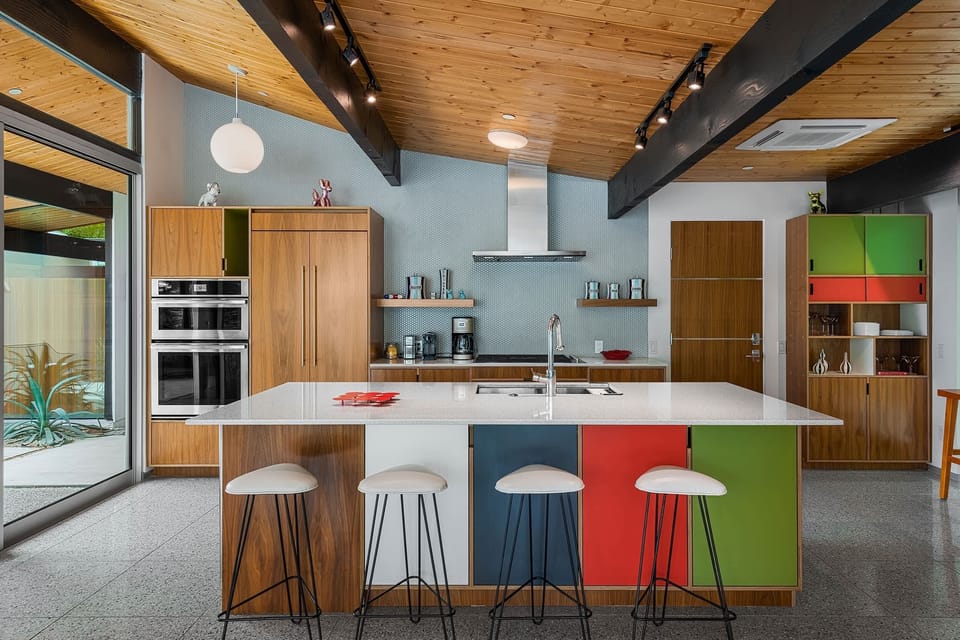 Gather around the stylish kitchen bar with seating for two. Featuring stainless steel appliances, sleek countertops, and ample cabinet space, it's the perfect space to cook and gather with family and friends, creating delicious memories together.