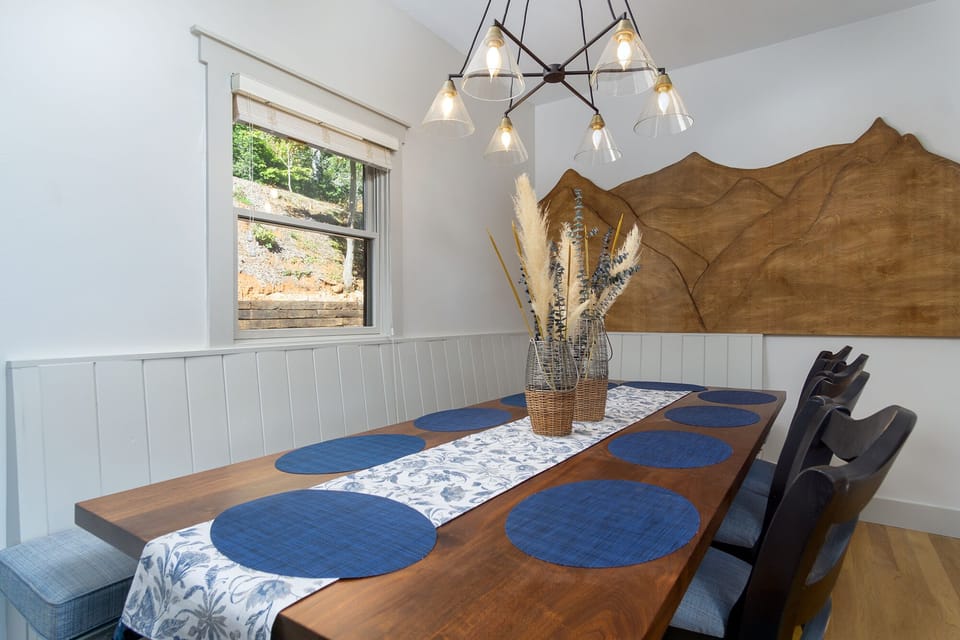 dinning area with custom black walnut table with seating for 10 
