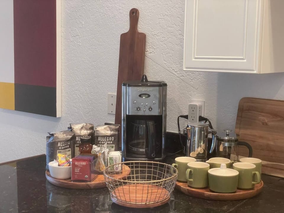 Coffee maker, stovetop espresso maker, French Press and pour over available. Organic French Roast, Decaf, and Espresso bean options. Selection of organic teas. Half and half single serve creamers, organic sugar packets and organic coconut sugar too.