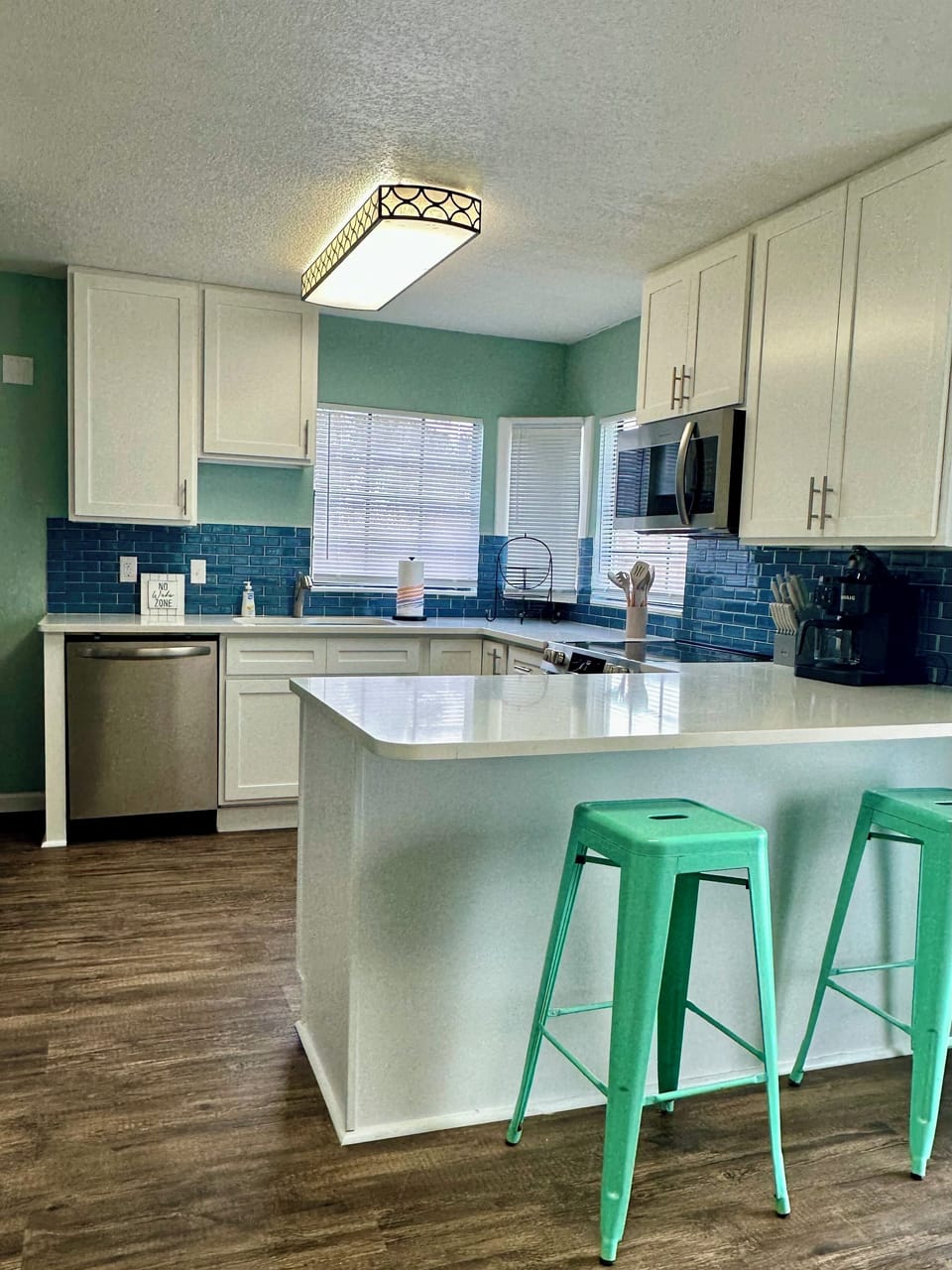 fully stocked kitchen with Keurig and drip coffee maker.