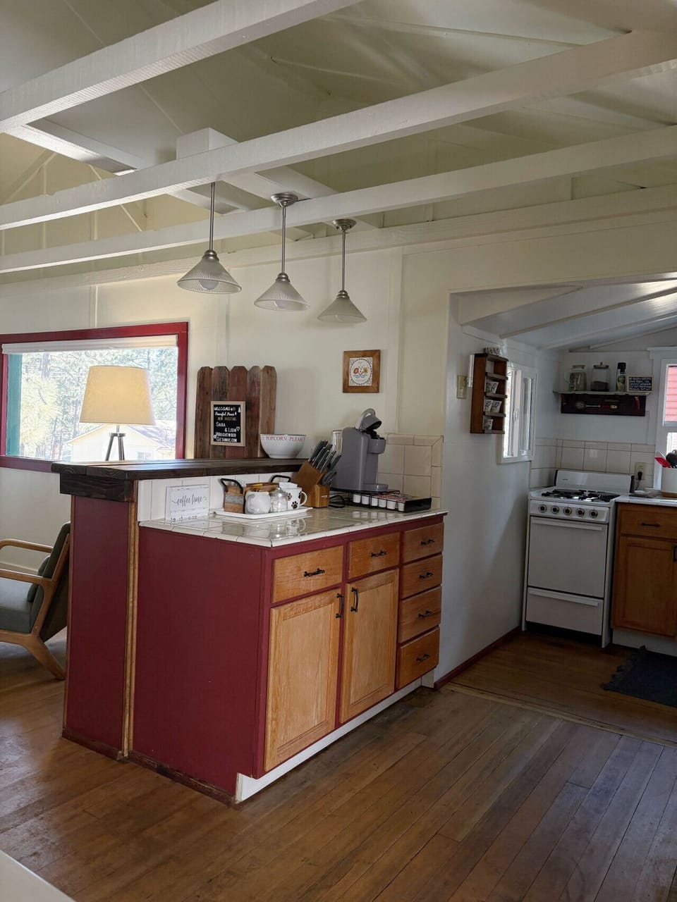Extra counter space in the kitchen with an apartment sized gas stove.
