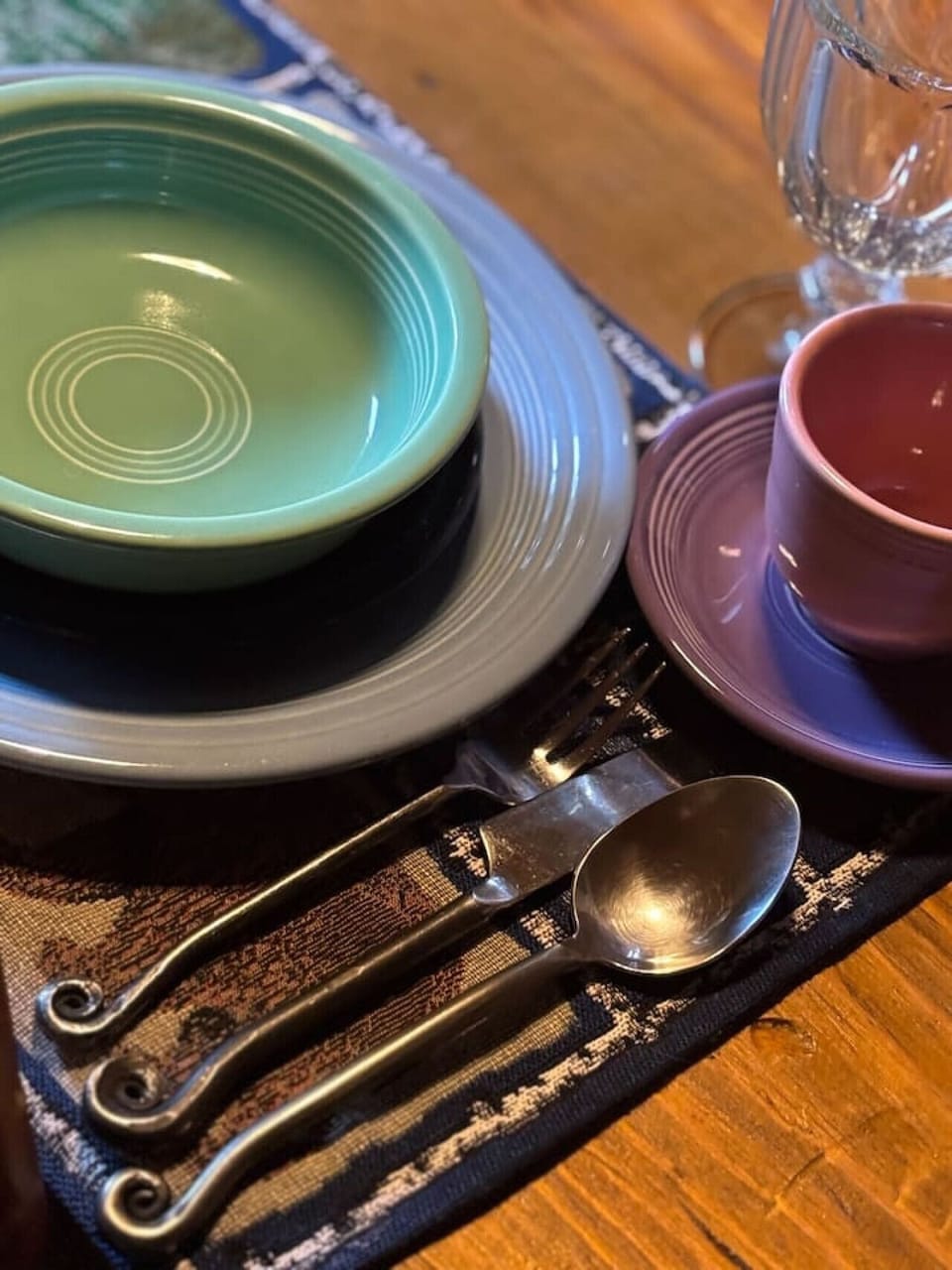 Colorful dishware for a cozy cabin meal.