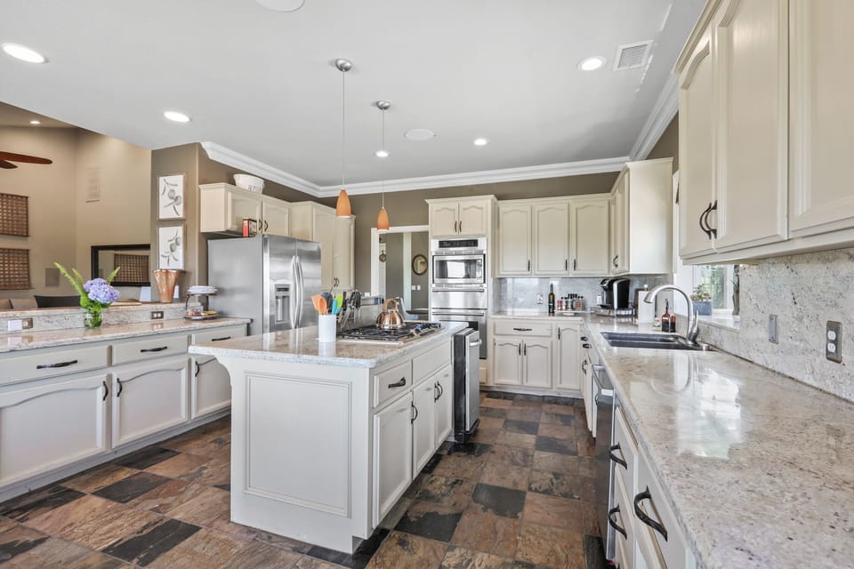 Kitchen w/island gas stove.