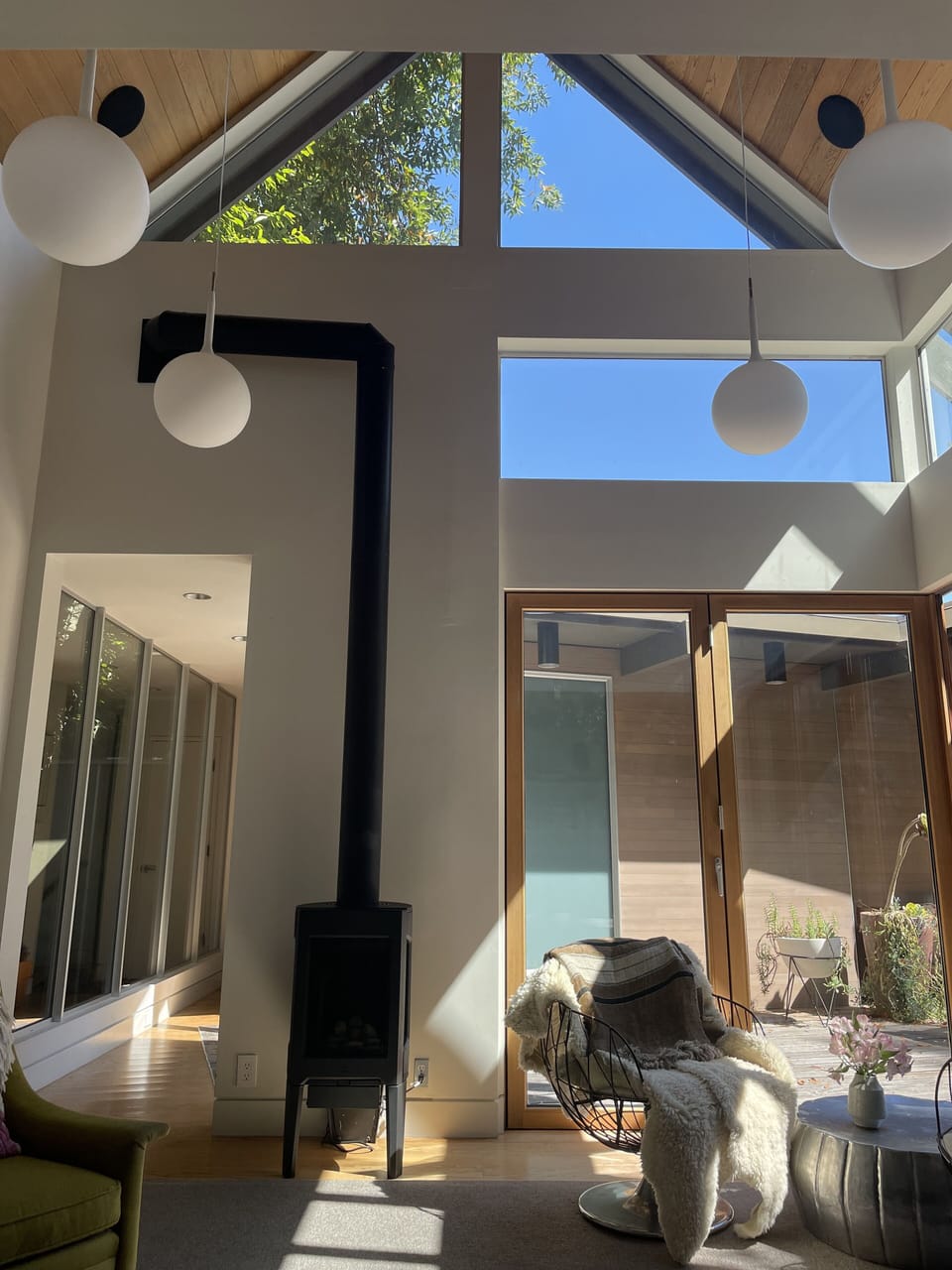 Family room w/big modular sofa, 65" TV, and a gas stove for instant coziness.