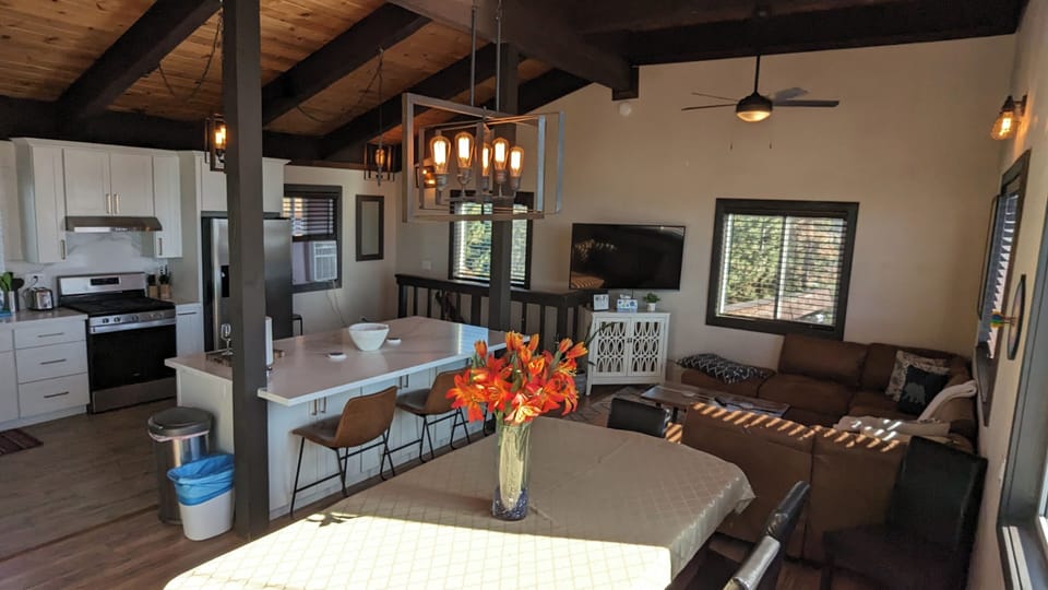 Top floor has open kitchen, dining table/pool table. 