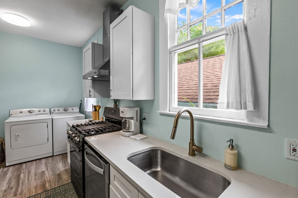 There is a full size washer and dryer conveniently located in the kitchen.