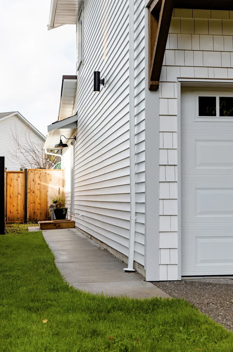 Parking in driveway and sidewalk leading to the private side entrance.