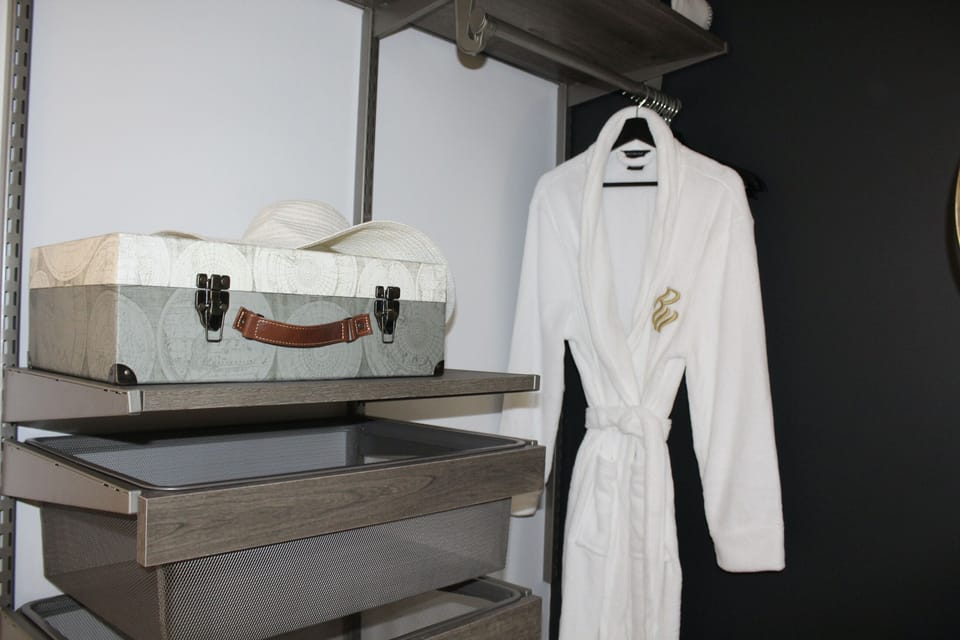 A place to hang your clothes with a shelf and 2 drawers.  Plus 2 Luggage racks 
