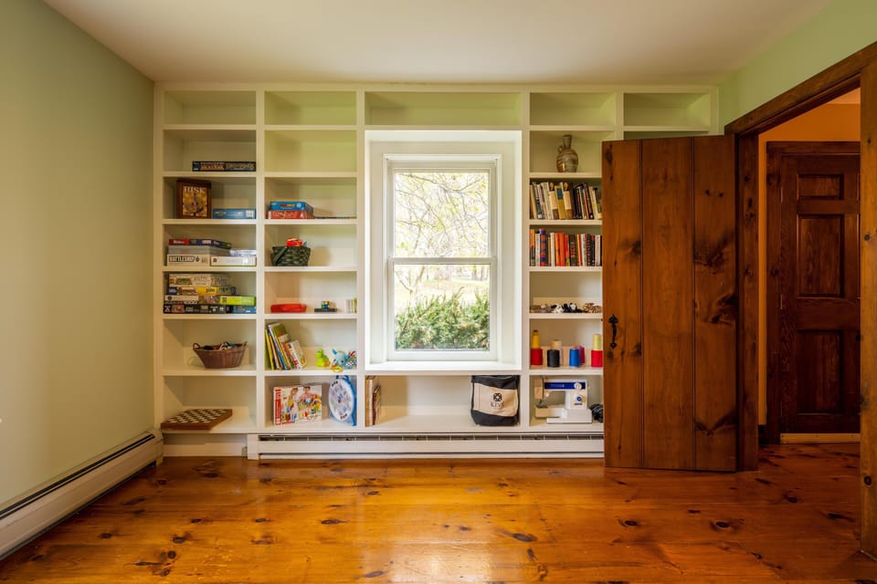 Office includes a selection of books, games, puzzles, and children's toys.