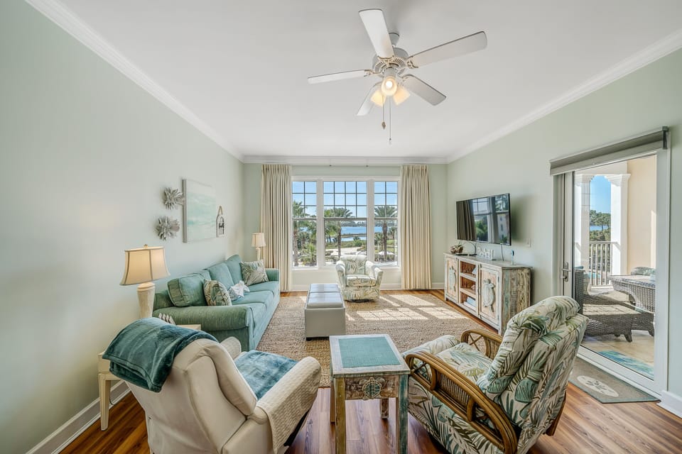 Living area with flat screen TV and sofa bed.