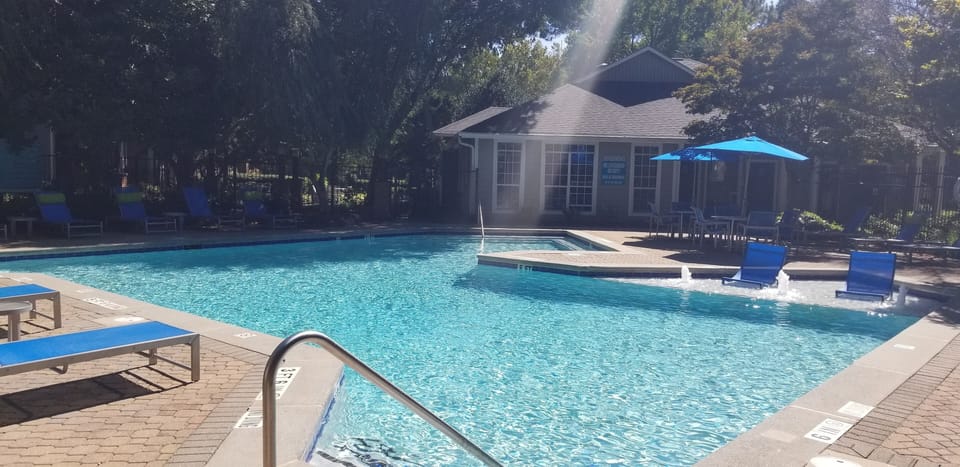 Beautiful Pool w/Water Falls & Lounge Chairs.