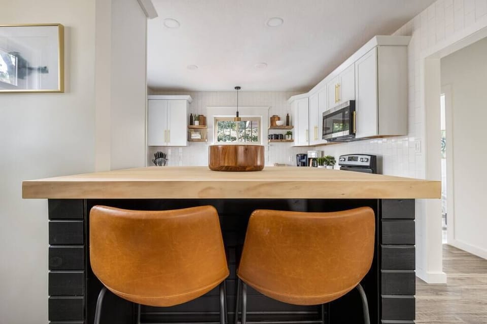 This custom kitchen breakfast bar includes 4 stools for gathering, working, or eating. 