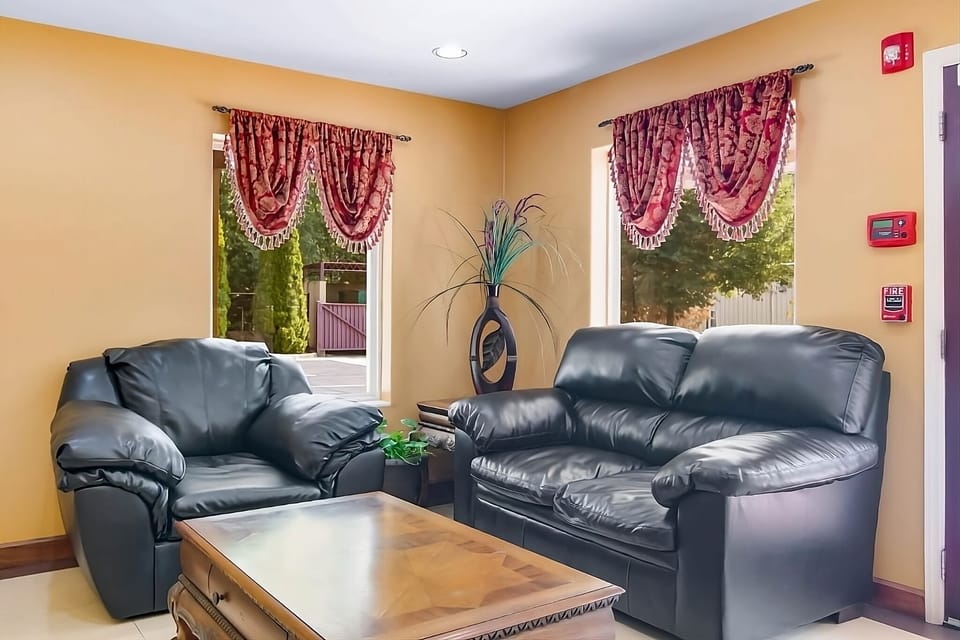 Relax in the lobby lounge with cozy seating and sunshine.