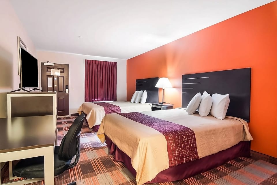 Stretch out on two plush beds after a busy day.