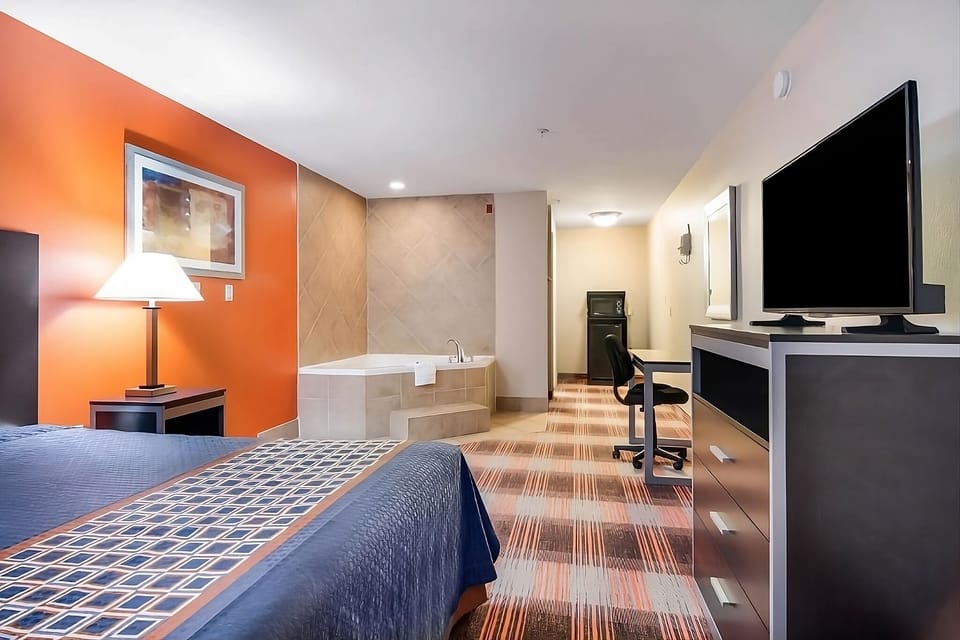 Imagine a long soak, then lounge comfortably with in-room TV.
