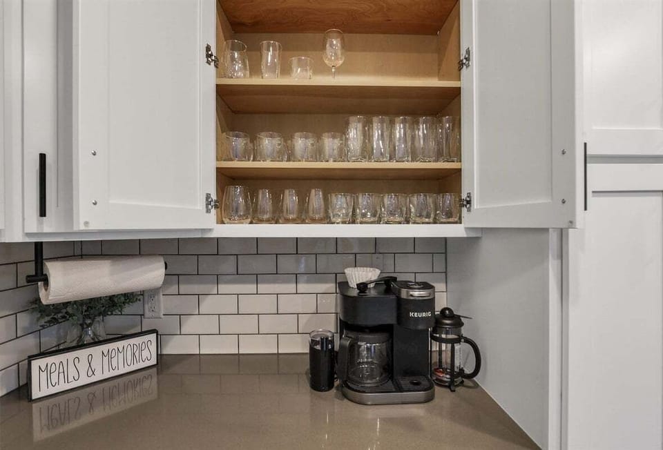 An organized cabinet stocked with glasses for everyday use.