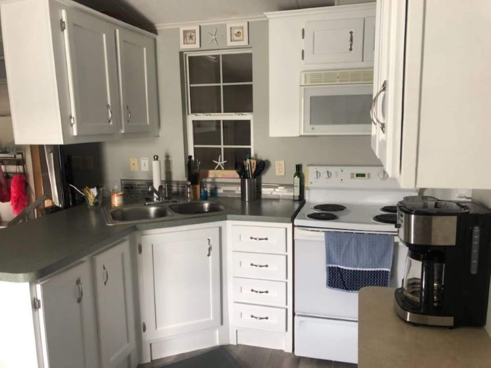 Well-stocked kitchen includes blender; coffee maker; air fryer; crock pot