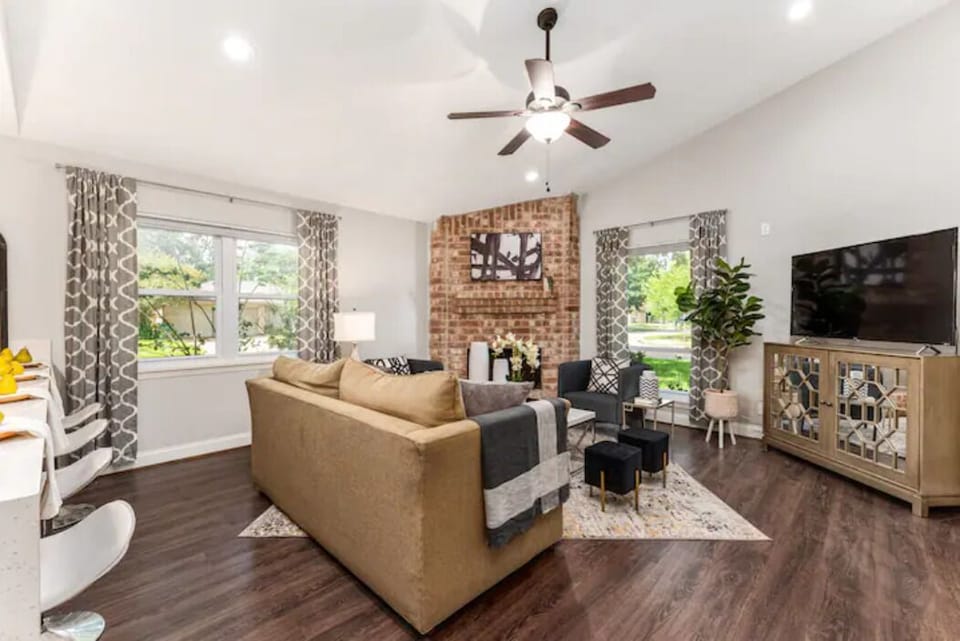 A large TV, stylish decor, comfort, and outside views make this room perfect