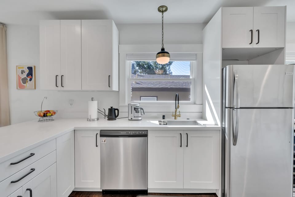Kitchen sink, dishwasher, and refrigerator