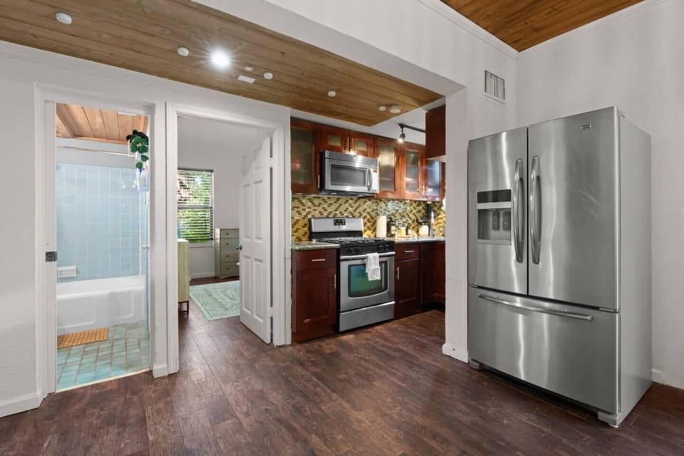 Experience the spaciousness of this open concept layout, where the living, dining, and kitchen areas seamlessly flow together, creating an inviting and airy atmosphere.
