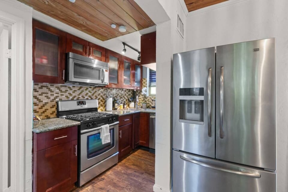 Enjoy the convenience of a spacious fridge in this well-equipped kitchen, perfect for storing all your groceries and keeping everything fresh during your stay.