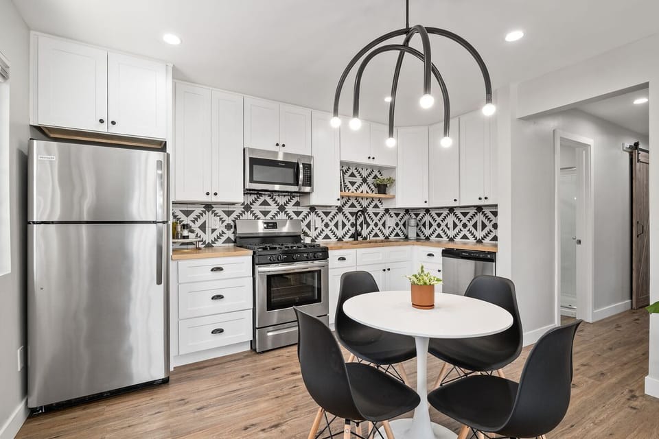 Remodeled kitchen w/ stainless steel appliances, new cabinets and countertops.