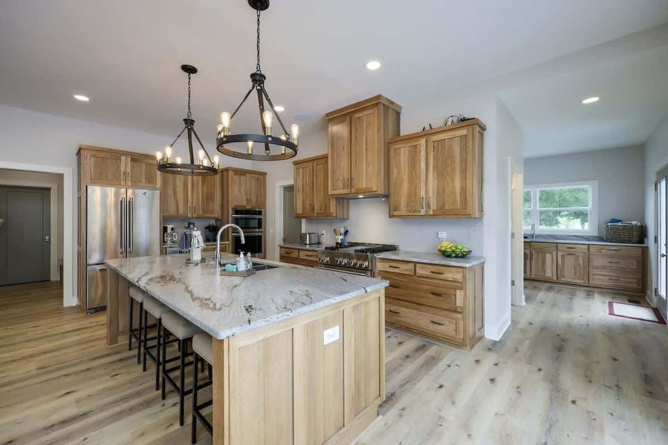 Giant gourmet-style kitchen with stainless steel appliances, and is fully stocked with your basic cooking essentials.