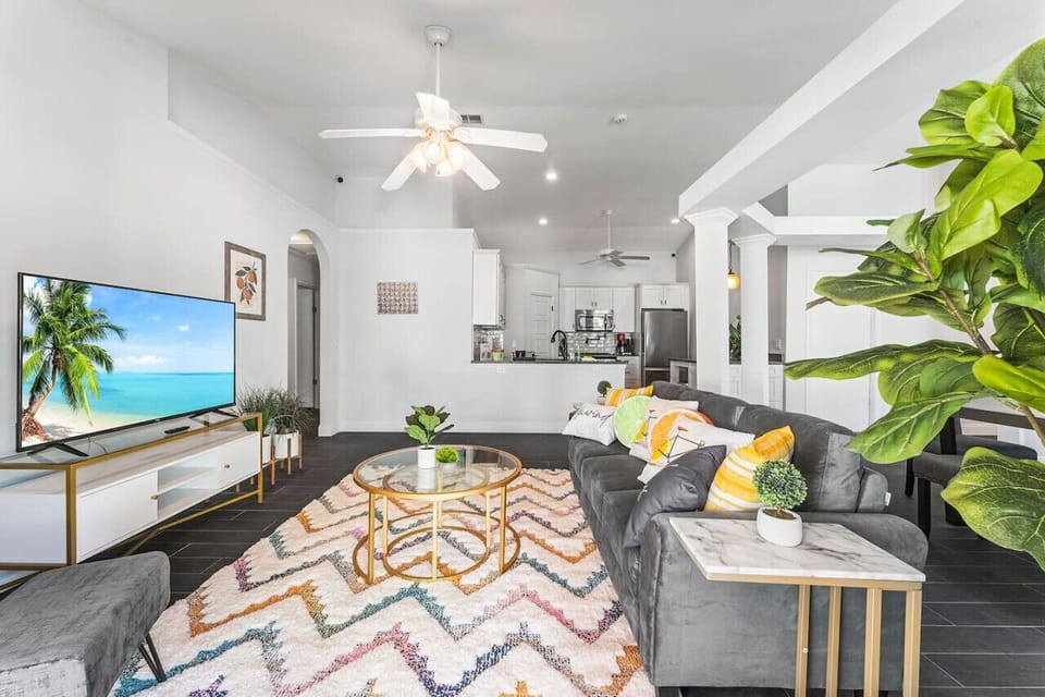 Brighten your stay in this vibrant living room, featuring comfortable seating and a Smart TV for ultimate relaxation and entertainment.