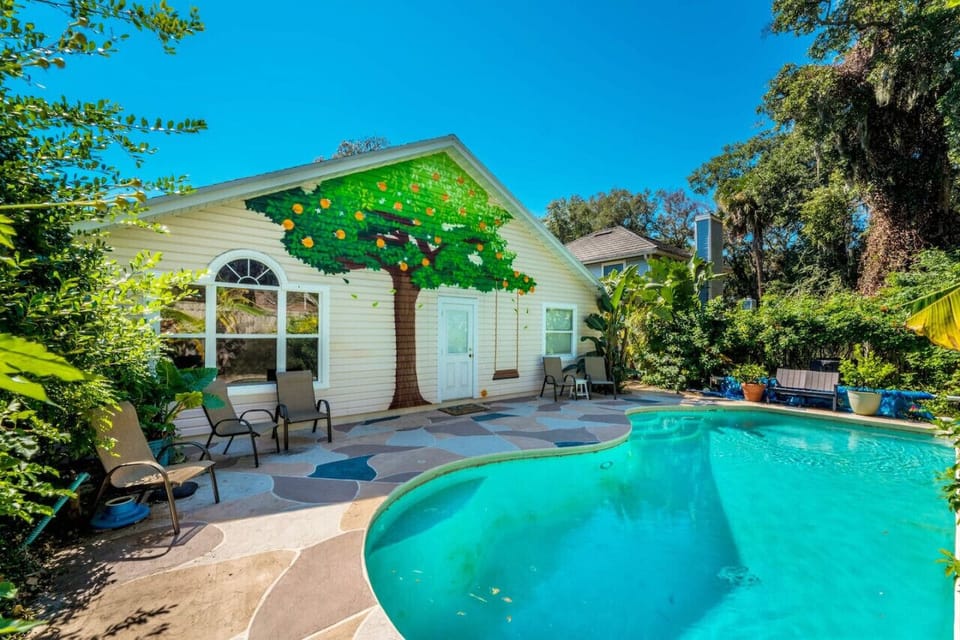 Enjoy the perfect blend of luxury and nature with a heated pool surrounded by lush landscaping – ideal for a refreshing escape.