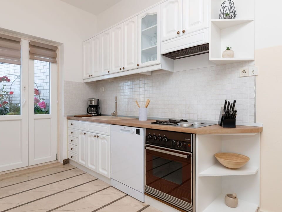 Cabinetry, Property, Countertop, Kitchen, Wood, Interior Design, Kitchen Stove, Floor, Flooring, Wood Stain