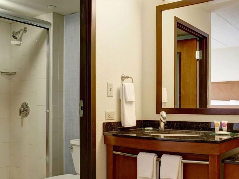 Refresh easily with a bright vanity and roomy shower.
