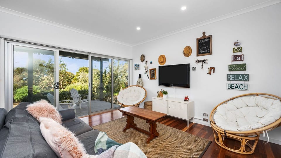 A living room, you can relax watching the Smart TV with WiFi and surround sound system.