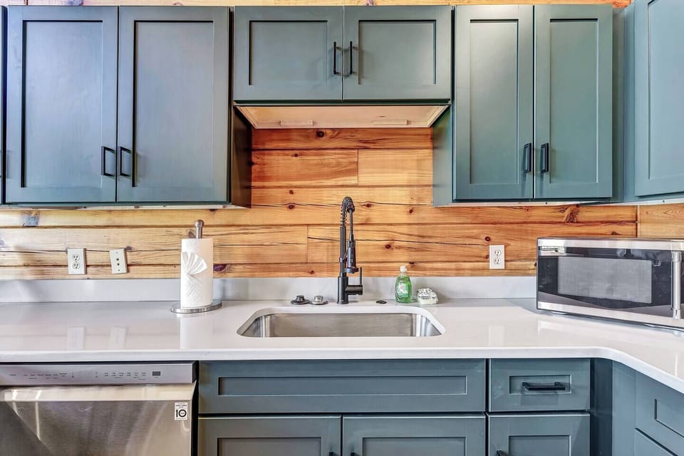The cabin has a modern kitchen with stainless steel LG appliances which creates a sleek and sophisticated space to entertain.