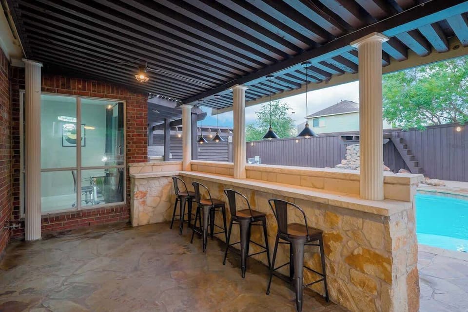 A bar with chairs