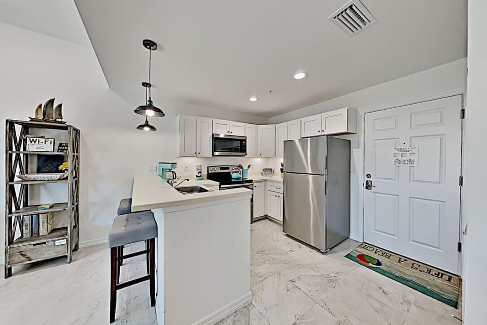 Full kitchen at your Madeira Beach vacation condo — everything you need, nothing you don`t