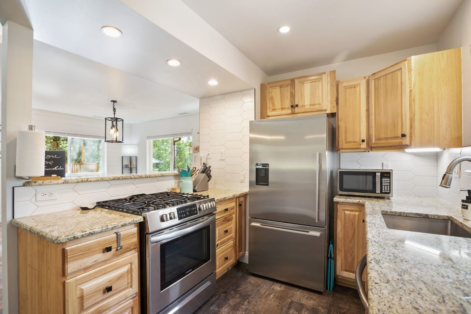 Spices, utensils, cookware, a gas range, microwave & fridge at your fingertips. 