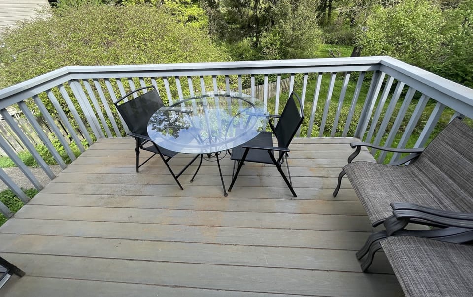 Uncovered Deck / Balcony with BBQ & Chairs (view #2)