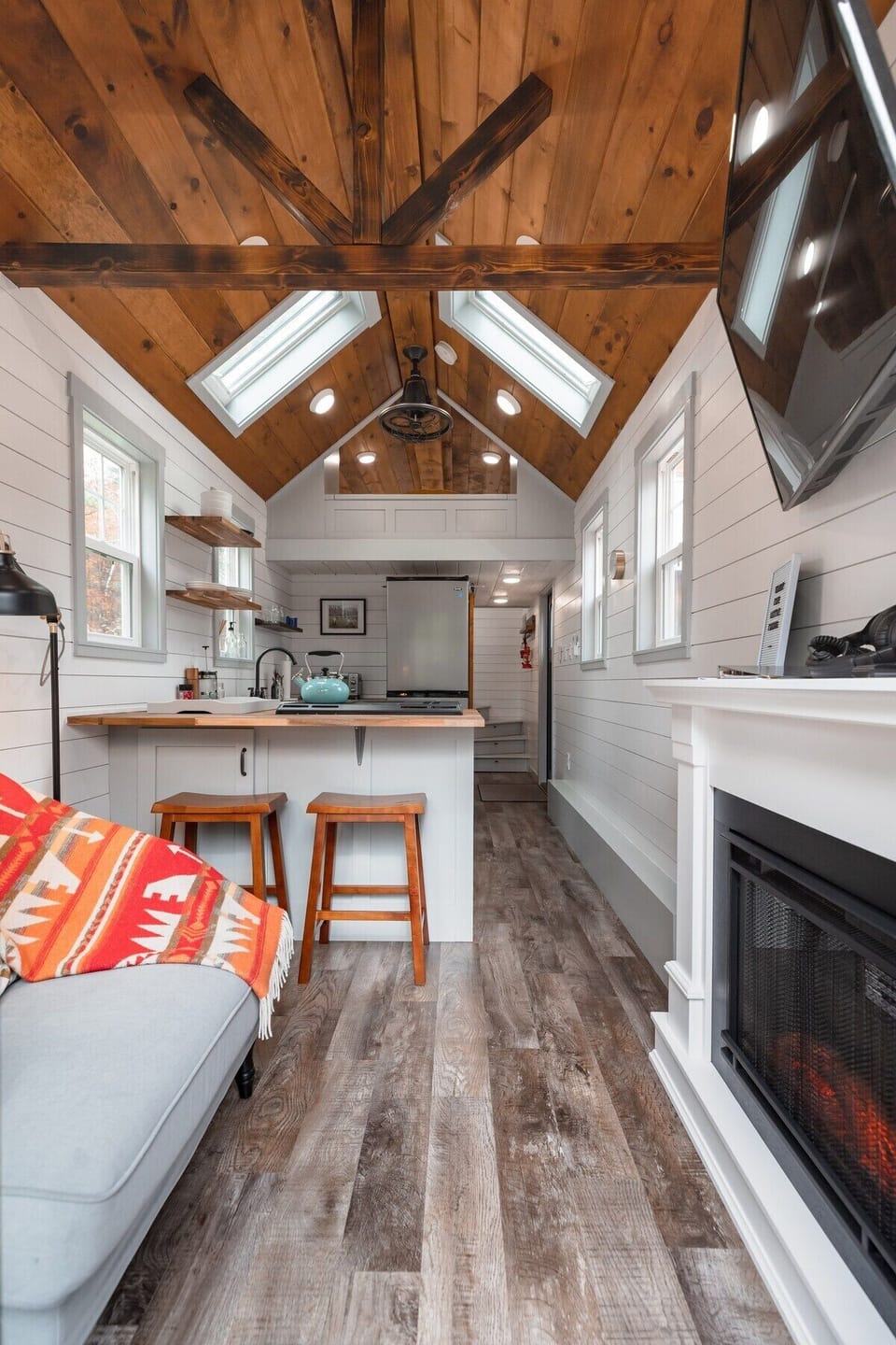 Our main floor. Complete with a full-sized kitchen, reading nook, and fireplace.