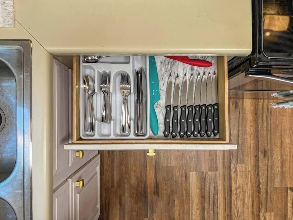 Kitchen stocked with cutlery, utensils